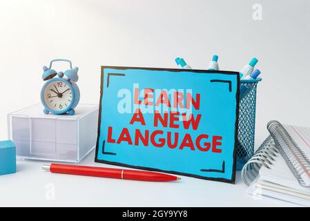 Conceptual display Learn A New Language, Business idea ability to communicate in the second orforeign language Tidy Workspace Setup Writing Desk Tools Stock Photo