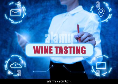 Conceptual caption Wine Tasting, Word Written on Degustation Alcohol Social gathering Gourmet Winery Drinking Lady In Uniform Holding Tablet In Hand V Stock Photo