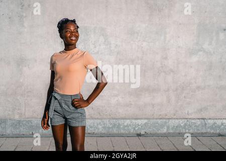 black woman posing proud on the street Stock Photo