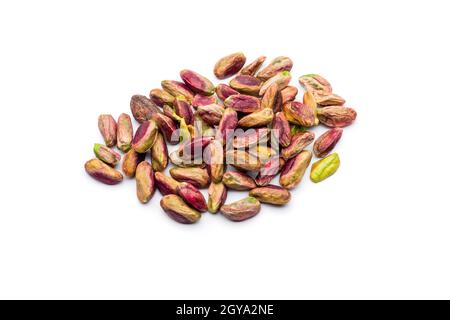 Peeled pistachios bunch on white background Stock Photo