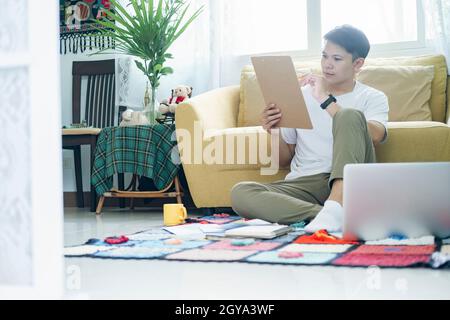Young man online working and learning from home. Stock Photo