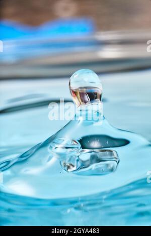 Aqua blue waterdrop with mysterious reflection Stock Photo