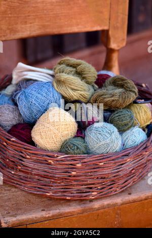 Balls of wool yarn dyed with natural plant pigments at El Rancho de las Golondrinas living history complex near Santa Fe, New Mexico. Stock Photo