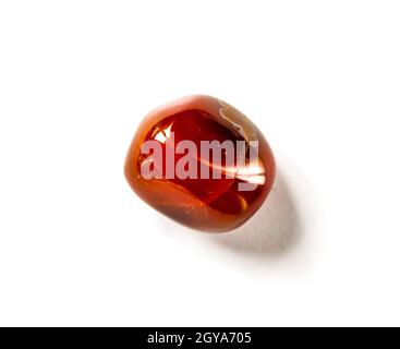 Carnelian agate gemstone isolated on a white background Stock Photo