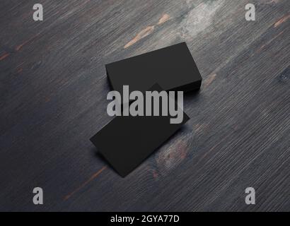 Photo of blank black business cards on wooden background. Template for ID. Stock Photo