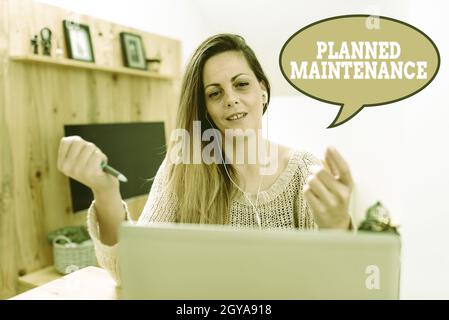Hand writing sign Planned Maintenance, Concept meaning reventive maintenance carried out base on a fixed plan Abstract Watching Online Movies, Viewing Stock Photo