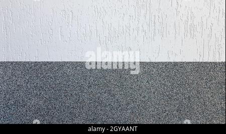 A horizontal stucco wall background divided in half with orange