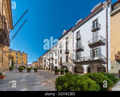 Cuneo, Piedmont, Italy - October 6, 2021: Via Roma (Rome Street) with historic colorful buildings with arcades (portici of Cuneo) Stock Photo