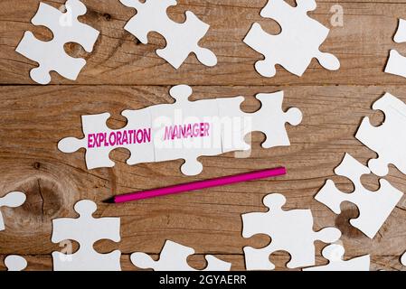 Writing displaying text Exploration Manager, Conceptual photo lead and operate the mining company s is exploration Building An Unfinished White Jigsaw Stock Photo