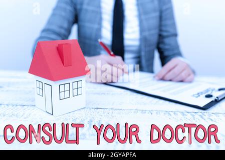 Inspiration showing sign Consult Your Doctor, Business idea ask information or advice from a medical professional New home installments and investment Stock Photo