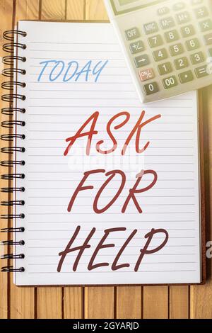 Text caption presenting Ask For Help, Business approach put a question or seek an answer or assistance from someone Blank Open Spiral Notebook With A Stock Photo