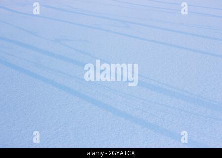 Snow background, white blanket and lines with shadows. Stock Photo