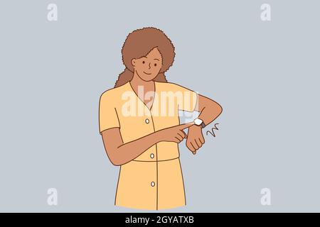 Deadline, being late, impatience concept. Young beautiful african american girl wearing casual dress standing In hurry pointing to watch time feeling Stock Photo