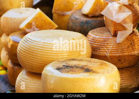Different sorts of farm made italian cheese produced from goat milk Stock Photo