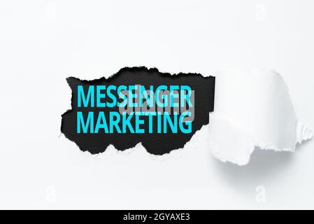Inspiration showing sign Messenger Marketing, Internet Concept act of marketing to your customers using a messaging app Tear on sheet reveals backgrou Stock Photo