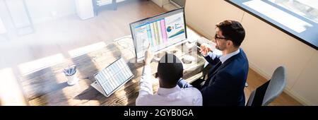 Spreadsheet Data On Computer Monitor In Office Stock Photo