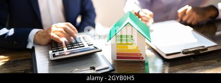 Energy Efficient House Audit Using Calculator. High Efficiency Stock Photo