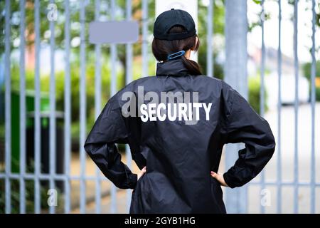 Security Guard Officer In Uniform. Guard Service Woman Standing Stock Photo