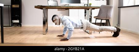 Workout Office Exercise. Healthy African American Doing Pushups Stock Photo