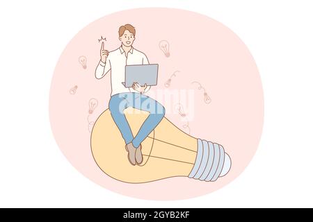 Idea, innovation, solution concept. Young businessman with laptop sitting on large light bulb and showing one finger meaning having great idea for bus Stock Photo
