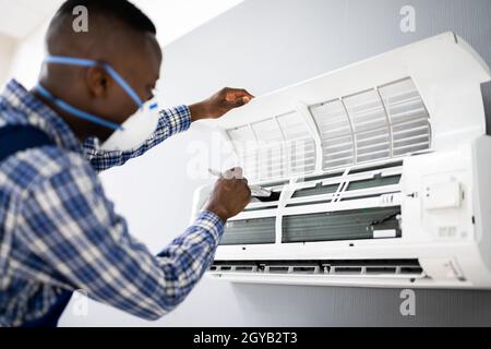 Air Conditioning Checking And Filter Cleaning. Maintenance Service Stock Photo