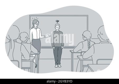 Studying in school, introducing, pupil and teacher concept. Teacher introducing new stressed frustrated boy pupil to classmates in classroom at school Stock Photo
