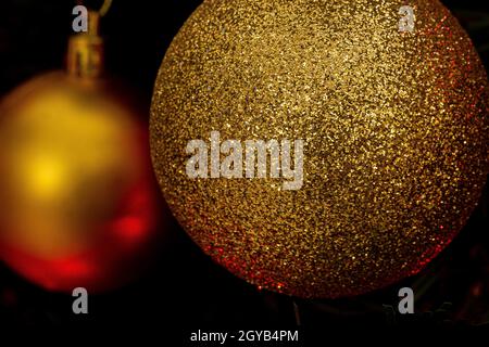 Various Christmas tree decorations and red blurred light on background Stock Photo