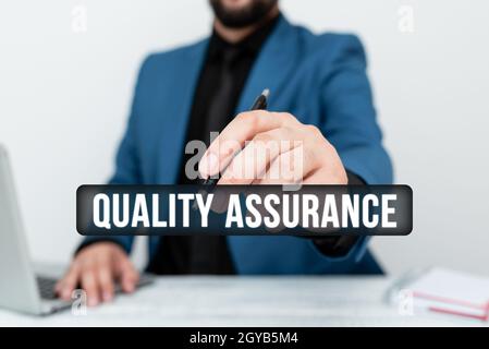 Text sign showing Quality Assurance, Business concept preventing mistakes and defects in manufactured products Remote Office Work Online Presenting Bu Stock Photo