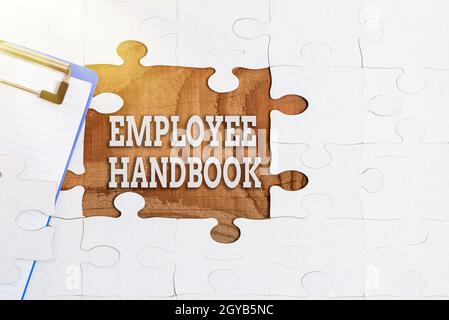 Inspiration showing sign Employee Handbook, Word Written on states the rules and regulations and policies of a company Building An Unfinished White Ji Stock Photo