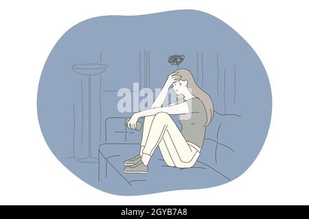 Sadness, mental depression, bad news concept. Young unhappy woman sitting on sofa touching forehead feeling depressed with thoughts after negative eve Stock Photo