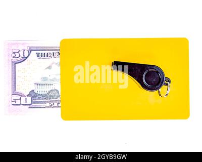 Warning cards and money of a football referee.. Corruption of a football referee for money. Money. Soccer referee cards. Sport. Tote. Bribe. Rates. Br Stock Photo