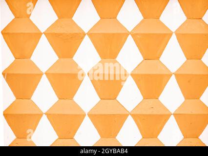 Texture of the painted wall with rhombuses in two colors. Background image. Place for text. Template. Stock Photo