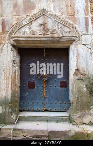 old door on the facade of a house in Kutaisi Stock Photo