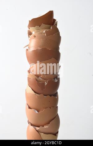 close up of egg shells piled up on white background Stock Photo