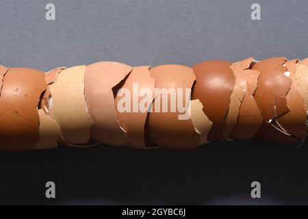 close up of egg shells piled up on gray background Stock Photo
