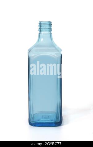 blue glass bottle of dry gin standing on white background Stock Photo
