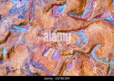 Beautiful swirl of colors from pictured rocks with teal, red, orange and brown Stock Photo
