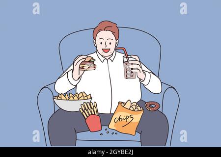 Over weight and unhealthy eating concept. Young smiling man cartoon character sitting in armchair eating burger french fries and drinking lemonade vec Stock Photo