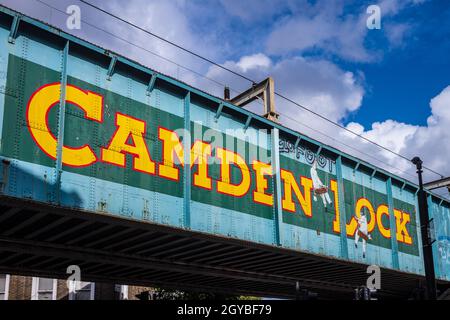 Camden Lock London - Painted bridge sign at Camden Lock, Camden, London. Camden Lock is a very popular tourist and fashion market destination. Stock Photo