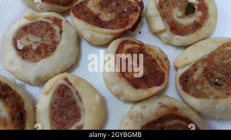 Closeup of delicious home made pinwheel puff pastries food item placed over white background Stock Photo