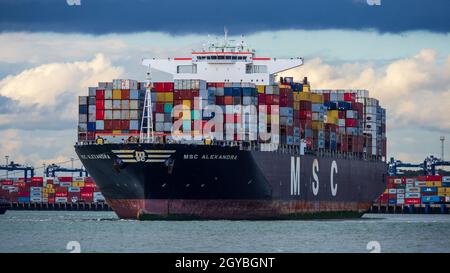 Global Supply Chains - Containers on the MSC Alexandra Container Ship arriving at the Port of Felixstowe UK as part of the Global Supply Chain.. Stock Photo