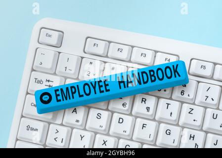 Text caption presenting Employee Handbook, Business overview states the rules and regulations and policies of a company Typing Engineering Lessons And Stock Photo