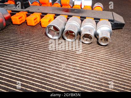 Spanner socket set for nuts and bolts. Locksmith tools for loosening bolts and nuts. Removable wrench caps. Car mechanic metal tool. Repair mechanic's Stock Photo