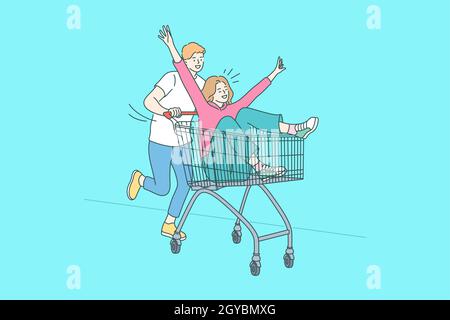 Funny shopping, Having fun, togetherness concept. Positive man and woman cartoon characters riding on shopping cart and having fun together over blue Stock Photo