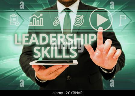 Sign displaying Leadership Skills, Business idea Skills and qualities that leaders possess Taking a lead Man In Office Uniform Standing Pressing Virtu Stock Photo