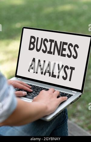 Hand writing sign Business Analyst, Word Written on someone who analyzes an organization or business domain Online Jobs And Working Remotely Connectin Stock Photo