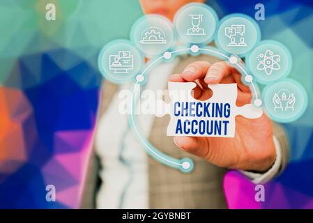 Text caption presenting Checking Account, Business overview bank account that allows you easy access to your money Business Woman Holding Jigsaw Puzzl Stock Photo