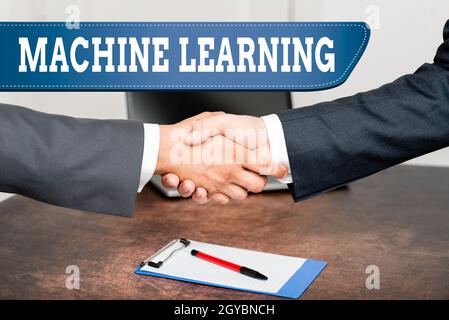 Sign displaying Machine Learning, Business idea scientific study of algorithms and statistical models Two Professional Well-Dressed Corporate Business Stock Photo