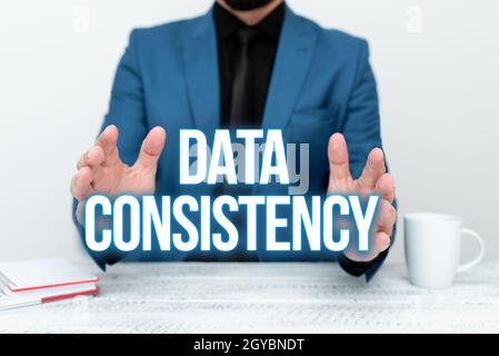 Hand writing sign Data Consistency, Business idea data values are the same for all instances of application Discussing Important Idea Presenting And E Stock Photo