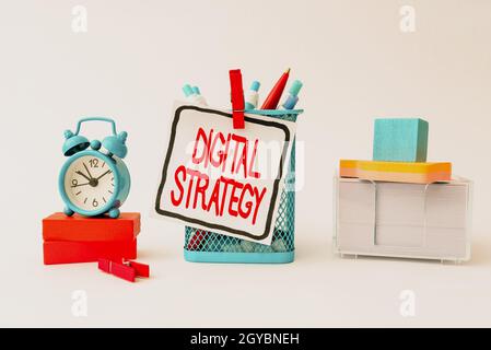 Writing displaying text Digital Strategy, Word for plan for maximizing the business benefits of data assets Tidy Workspace Setup Writing Desk Tools An Stock Photo